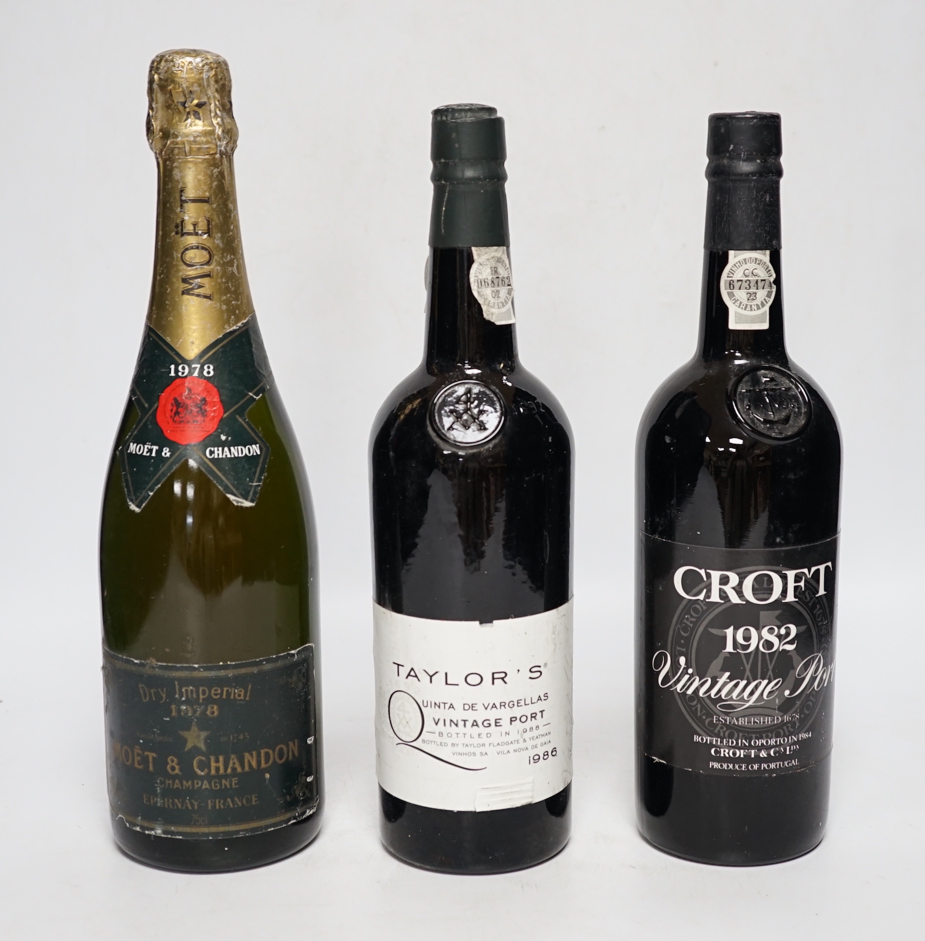 A bottle of Moët & Chandon 1978 Dry Imperial Champagne, a bottle of Croft 1982 Vintage Port and a Taylor’s 1986 Vintage Port (3)